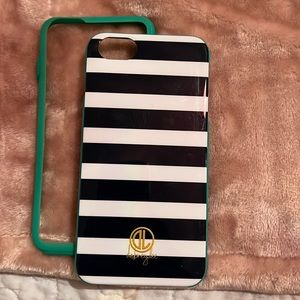 IPhone 7 Plus case teal in color with rubber piece.
